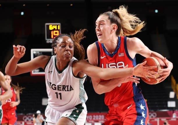 Breanna Stewart of Team United States drives to the basket against Adaora Elonu of Team Nigeria during the second half of a Women's Preliminary Round...