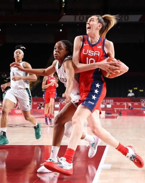 Breanna Stewart of Team United States drives to the basket against Adaora Elonu of Team Nigeria during the second half of a Women's Preliminary Round...