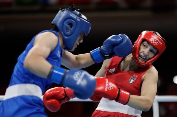 Angela Carini of Italy exchanges punches with Nien Chin Chen of Chinese Taipei during the Women's Welter on day four of the Tokyo 2020 Olympic Games...