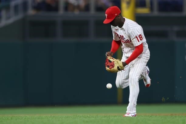 Shortstop Didi Gregorius of the Philadelphia Phillies makes an error on a ball hit by Josh Bell of the Washington Nationals in the ninth inning of a...