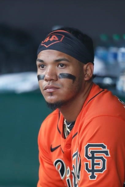 Thairo Estrada of the San Francisco Giants looks on from the dugout during the game against the Pittsburgh Pirates at Oracle Park on July 23, 2021 in...