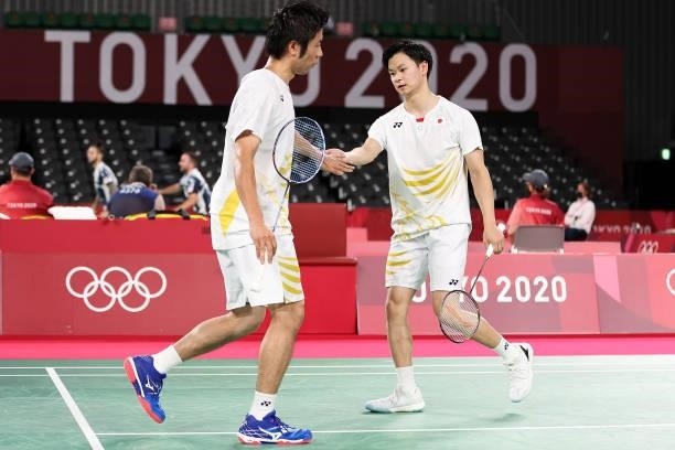 Hiroyuki Endo and Yuta Watanabe of Team Japan react as they win against Kim Astrup and Anders Skaarup Rasmussen of Team Denmark during a Men's...