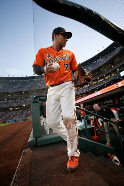 Donovan Solano of the San Francisco Giants walks out from the dugout during the game against the Pittsburgh Pirates at Oracle Park on July 23, 2021...