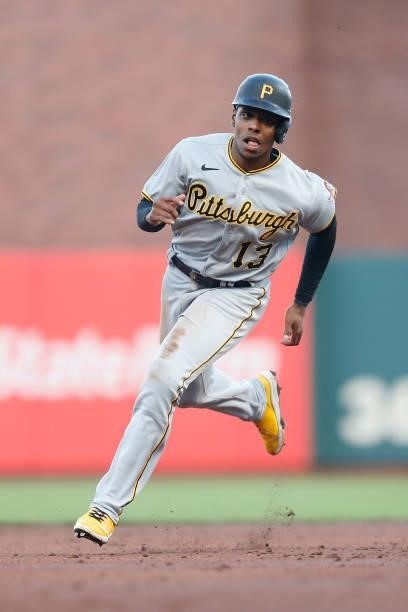 Ke'Bryan Hayes of the Pittsburgh Pirates rounds the bases to score on a home run by Bryan Reynolds against the San Francisco Giants at Oracle Park on...