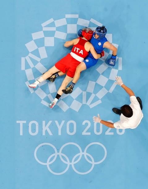 Angela Carini of Italy falls on Nien Chin Chen of Chinese Taipei during the Women's Welter on day four of the Tokyo 2020 Olympic Games at Kokugikan...