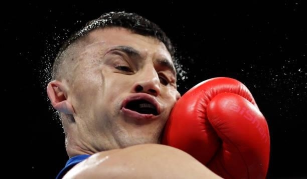 Bobo Usmon Baturov of Uzbekistan gets a hit during the Men's Welter on day four of the Tokyo 2020 Olympic Games at Kokugikan Arena on July 27, 2021...