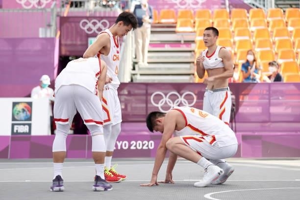 Team China looks on after the loss in the 3x3 Basketball competition on day four of the Tokyo 2020 Olympic Games at Aomi Urban Sports Park on July...
