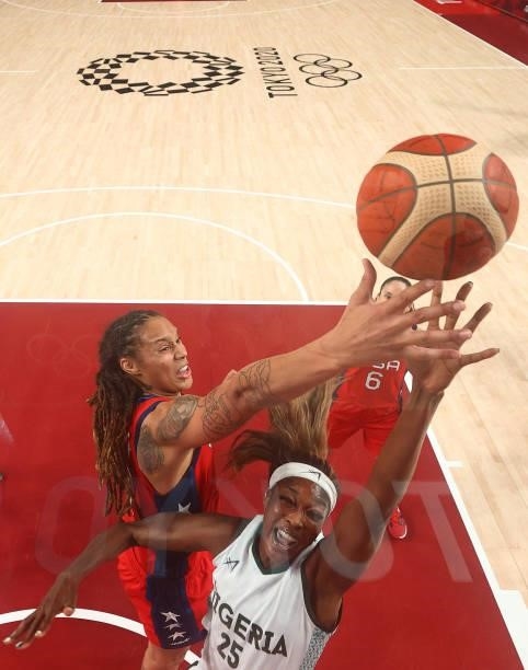 Victoria Macaulay of Team Nigeria and Brittney Griner of Team United States \go after a rebound during the second half of a Women's Preliminary Round...