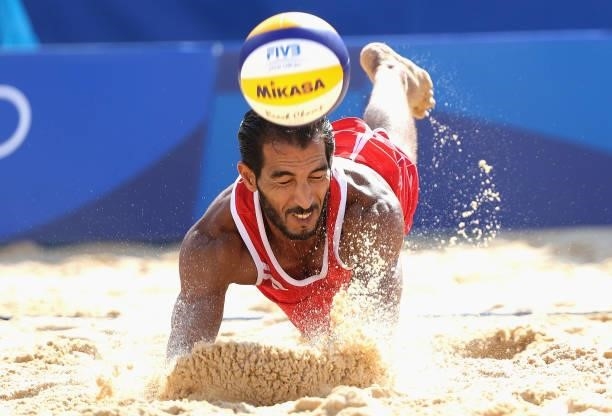 Mohammed Abicha of Team Morocco competes against Team Brazil during the Men's Preliminary - Pool E beach volleyball on day four of the Tokyo 2020...