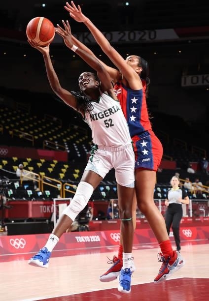 Ify Ibekwe of Team Nigeria is pressured by A'Ja Wilson of Team United States during a Women's Preliminary Round Group B game on day four of the Tokyo...