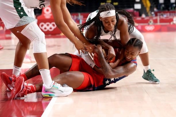Ezinne Kalu of Team Nigeria and Jewell Loyd of Team United States tangle for a loose ball during the second half of a Women's Preliminary Round Group...