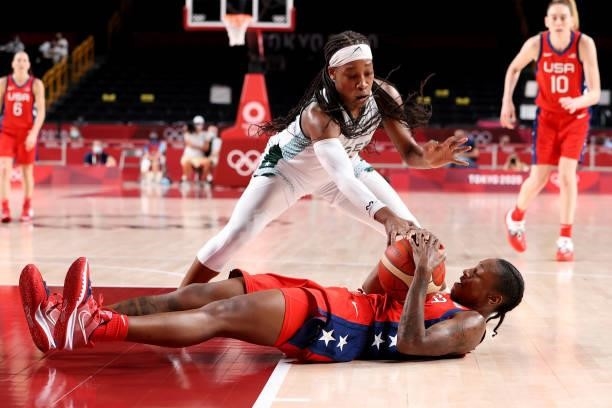 Ezinne Kalu of Team Nigeria and Jewell Loyd of Team United States tangle for a loose ball during the second half of a Women's Preliminary Round Group...