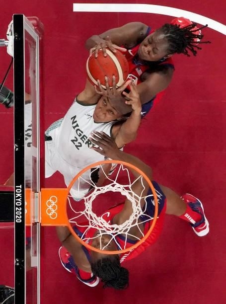 Oderah Chidom of Team Nigeria and Tina Charles of Team United States fight for possession during the second half of a Women's Preliminary Round Group...