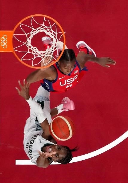 Promise Amukamara of Team Nigeria goes up for a shot against Jewell Loyd of Team United States during the second half of a Women's Preliminary Round...
