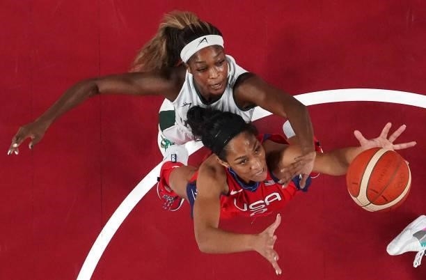 Ja Wilson of Team United States and Victoria Macaulay of Team Nigeria go after a rebound during a Women's Preliminary Round Group B game on day four...