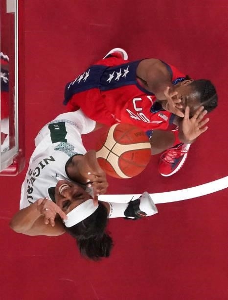 Jewell Loyd of Team United States and Atonye Nyingifa of Team Nigeria during the second half of a Women's Preliminary Round Group B game on day four...