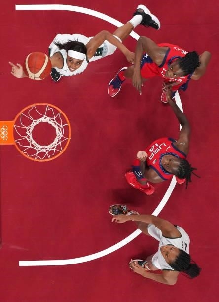 Atonye Nyingifa of Team Nigeria goes up for a shot agsinst Sylvia Fowles and Tina Charles of Team United States during the second half of a Women's...