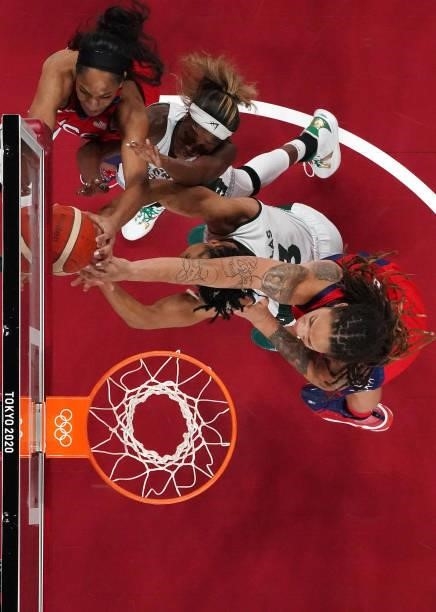 Ja Wilson and Brittney Griner of Team United States battle for a rebound against Victoria Macaulay and Pallas Kunaiyi-Akpanah of Team Nigeria during...