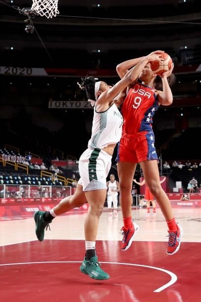 Ja Wilson of Team United States is pressured by Pallas Kunaiyi-Akpanah of Team Nigeria during the second half of a Women's Preliminary Round Group B...
