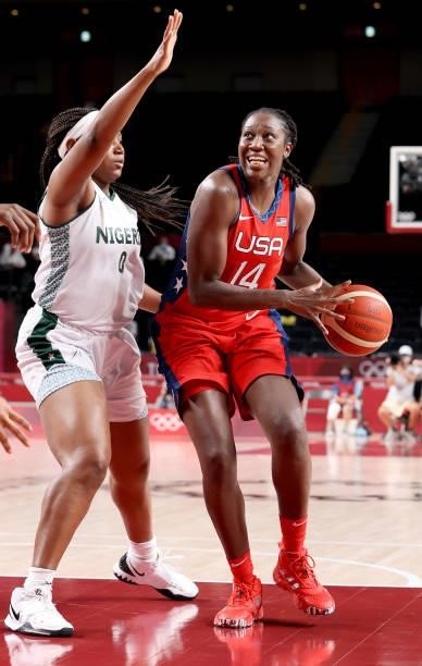 Tina Charles of Team United States is defended by Amy Okonkwo of Team Nigeria during the second half of a Women's Preliminary Round Group B game on...