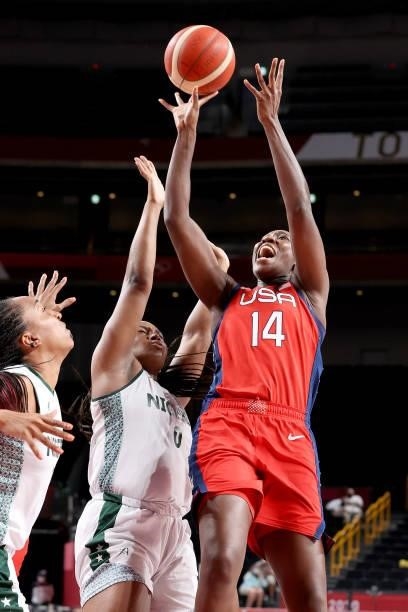 Tina Charles of Team United States goes up for a shot against Amy Okonkwo of Team Nigeria during the second half of a Women's Preliminary Round Group...
