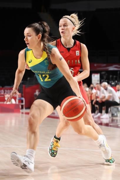 Tess Lavey of Team Australia drives past Julie Vanloo of Team Belgium during the first half of a Women's Preliminary Round Group C game on day four...