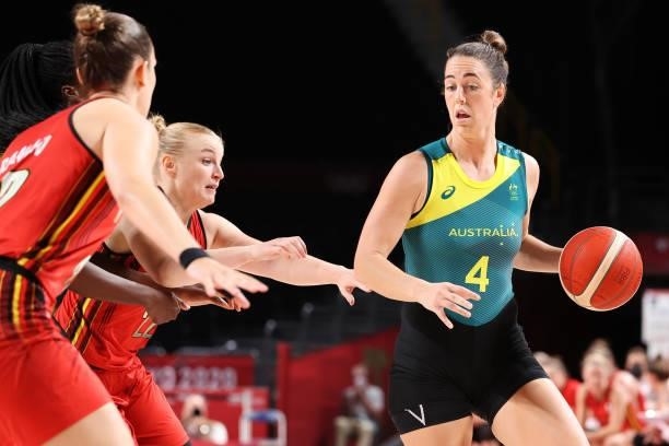 Jenna O'Hea of Team Australia looks to pass as she is pressured by Team Belgium defenders during the first half of a Women's Preliminary Round Group...