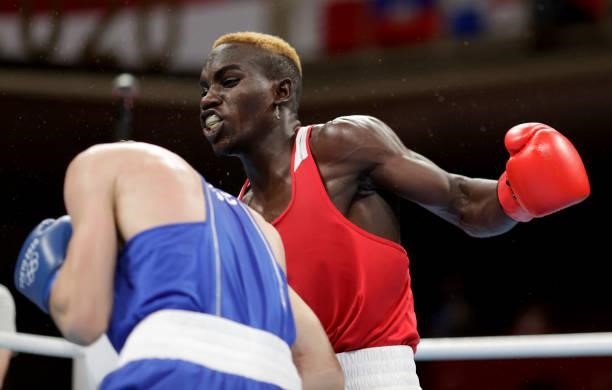 Stephen Zimba of Zimbabwe exchanges punches with Andrei Zamkovoi of Russian Olympic Committee during the Men's Welter on day four of the Tokyo 2020...