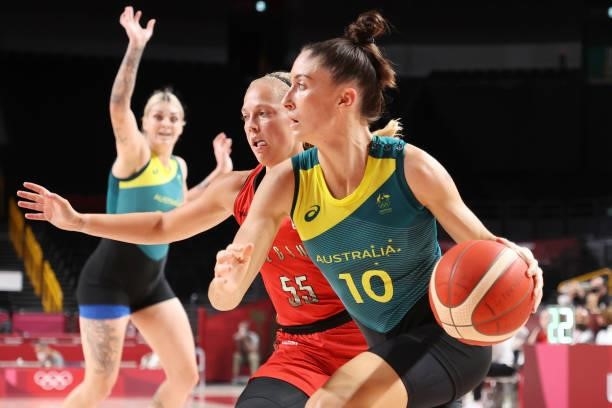 Katie Ebzery of Team Australia drives to the basket against Julie Allemand of Team Belgium during the first half of a Women's Preliminary Round Group...