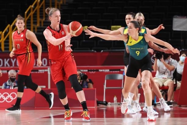 Emma Meesseman of Team Belgium passes the ball as she is pressured by Bec Allen of Team Australia during the first half of a Women's Preliminary...