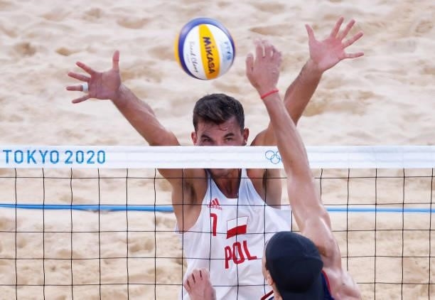 Michal Bryl of Team Poland competes against Esteban Grimalt of Team Chile during the Men's Preliminary - Pool E beach volleyball on day four of the...