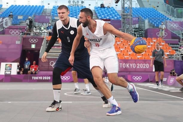 Dejan Majstorovic of Team Serbia handles the ball against Ilia Karpenkov of Team ROC in the 3x3 Basketball competition on day four of the Tokyo 2020...