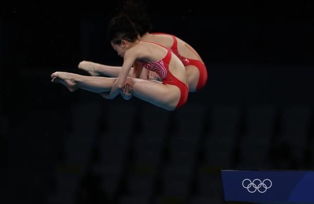 Yuxi Chen and Jiaqi Zhang of Team China compete during the Women's Synchronised 10m Platform Final on day four of the Tokyo 2020 Olympic Games at...