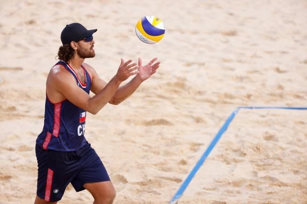Marco Grimalt of Team Chile prepares to serve against Team Poland during the Men's Preliminary - Pool E beach volleyball on day four of the Tokyo...