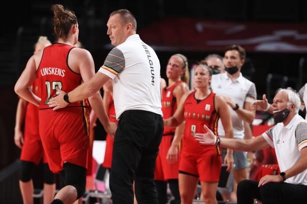 Team Belgium Head Coach Philip Mestdagh greets Kyara Linskens as she walks off the court during the second half of their Women's Preliminary Round...