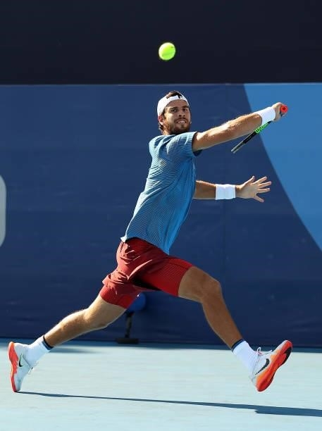 Karen Khachanov of Team ROC plays a backhand during his Men's Singles Second Round match against James Duckworth of Team Australia on day four of the...