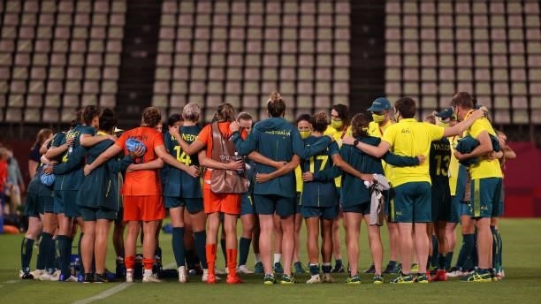 Players of Team Australia form a huddle following the Women's Football Group G match between United States and Australia on day four of the Tokyo...
