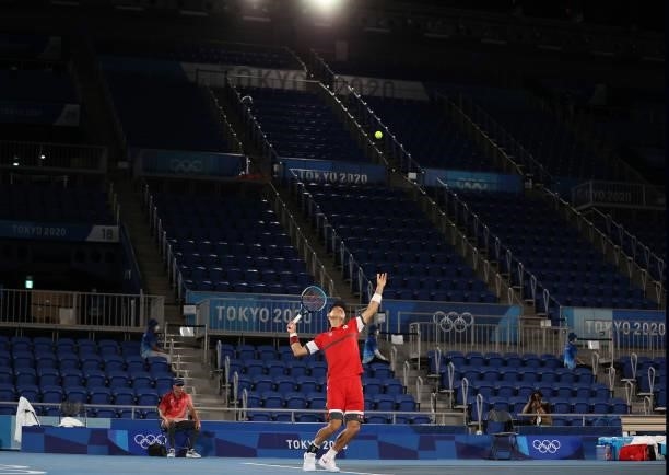 Kei Nishikori of Team Japan serves during his Men's Singles Second Round match against Marcos Giron of Team USA on day four of the Tokyo 2020 Olympic...