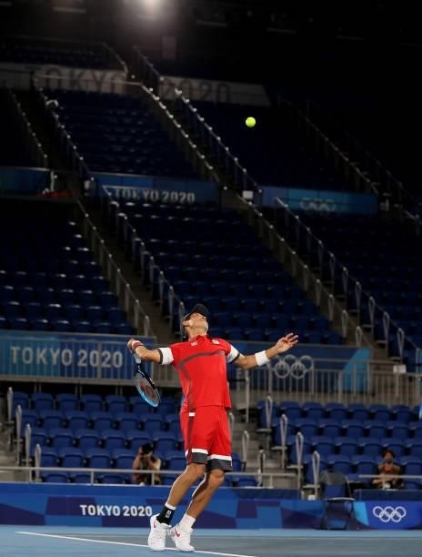 Kei Nishikori of Team Japan serves during his Men's Singles Second Round match against Marcos Giron of Team USA on day four of the Tokyo 2020 Olympic...