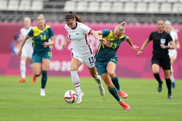 Alex Morgan of Team United States muscles through the midfield before a game between Australia and USWNT at Ibaraki Kashima Stadium on July 27, 2021...
