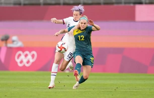 Ellie Carpenter of Team Australia battles with Megan Rapinoe of Team United States before a game between Australia and USWNT at Ibaraki Kashima...