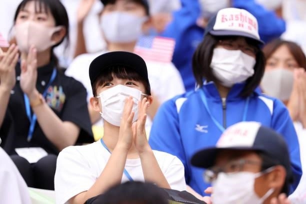 Fan wearing a face mask applauds during the Women's Football Group G match between United States and Australia on day four of the Tokyo 2020 Olympic...