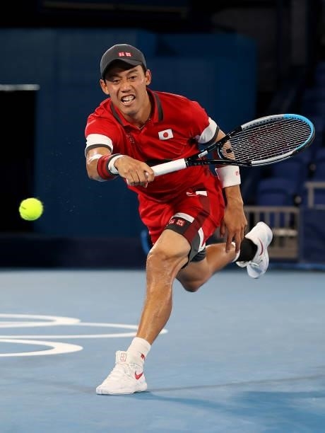 Kei Nishikori of Team Japan plays a forehand during his Men's Singles Second Round match against Marcos Giron of Team USA on day four of the Tokyo...