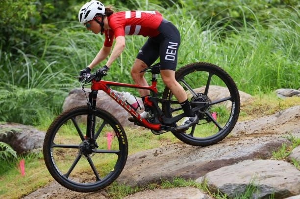 Caroline Bohe of Team Denmark rides during the Women's Cross-country race on day four of the Tokyo 2020 Olympic Games at Izu Mountain Bike Course on...