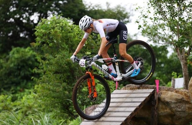 Ronja Eibl of Team Germany jumps during the Women's Cross-country race on day four of the Tokyo 2020 Olympic Games at Izu Mountain Bike Course on...