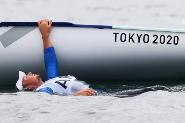 Facundo Mario Olezza Bazan of Team Argentina cools off in the water as he competes in the Men's Finn class on day four of the Tokyo 2020 Olympic...