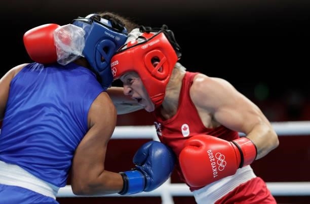 Myriam da Silva of Canada exchanges punches with Maria Altagracia Moronta Hernandez of Dominican Republic during the Women's Welter on day four of...