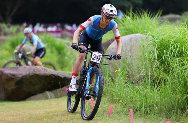 Haley Smith of Team Canada rides during the Women's Cross-country race on day four of the Tokyo 2020 Olympic Games at Izu Mountain Bike Course on...
