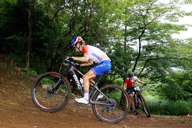 Pauline Ferrand Prevot of Team France and Sina Frei of Team Switzerland ride during the Women's Cross-country race on day four of the Tokyo 2020...