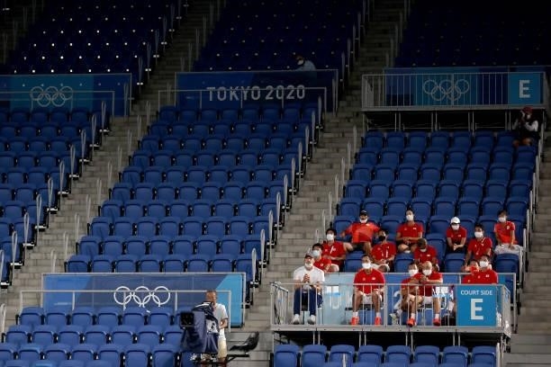 Japanese team members watch Kei Nishikori of Team Japan play Marcos Giron of Team USA in his Men's Singles Second Round match on day four of the...